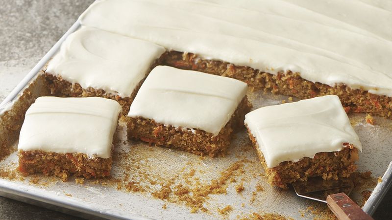 Carrot cake squares with cream cheese frosting.