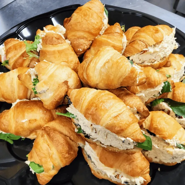 Tray of chicken salad croissant sandwiches