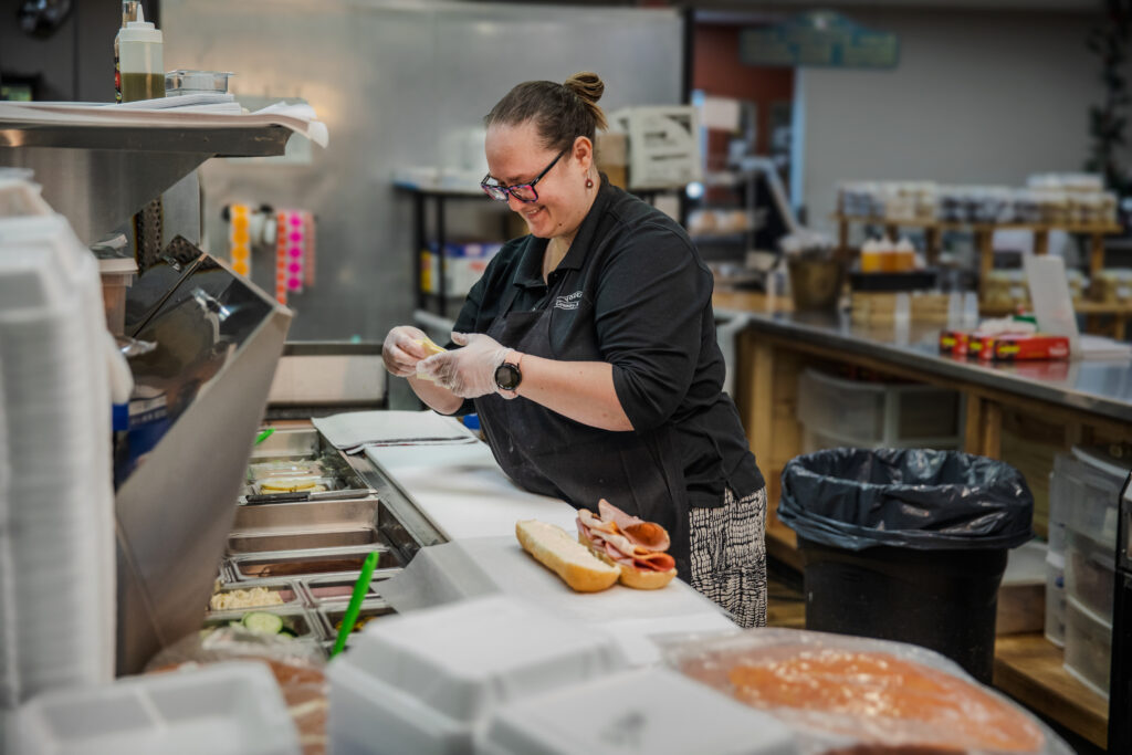 Staff making a sub sandwich