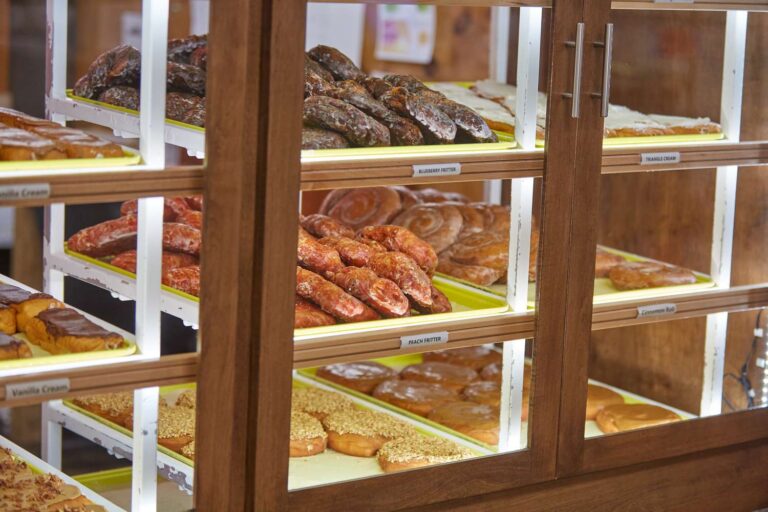 Baked goods displayed on bakery shelves.