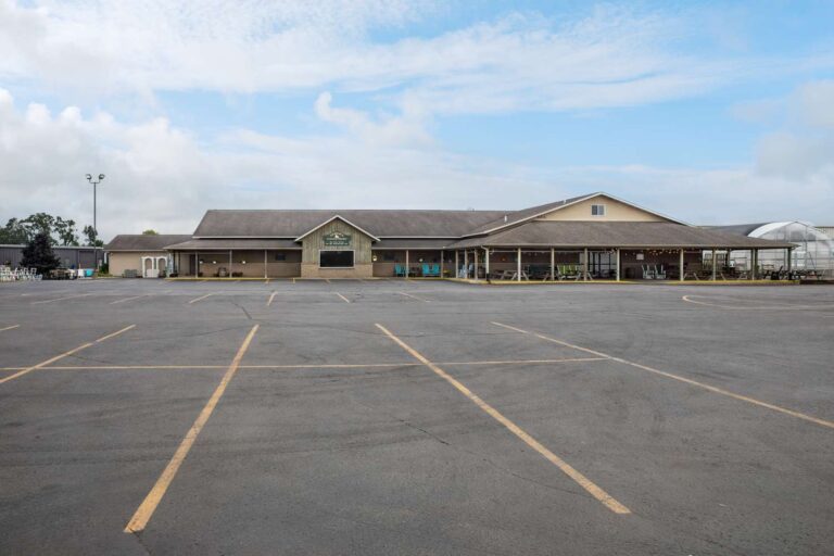 Large parking lot near retail building