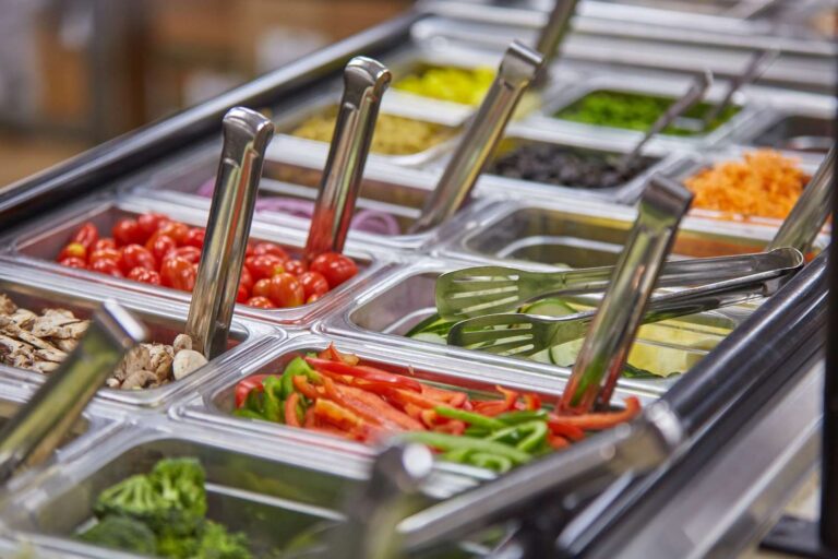 Salad bar with various fresh vegetables
