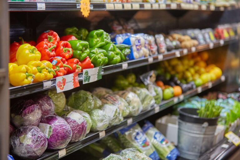Colorful vegetables on grocery store shelves